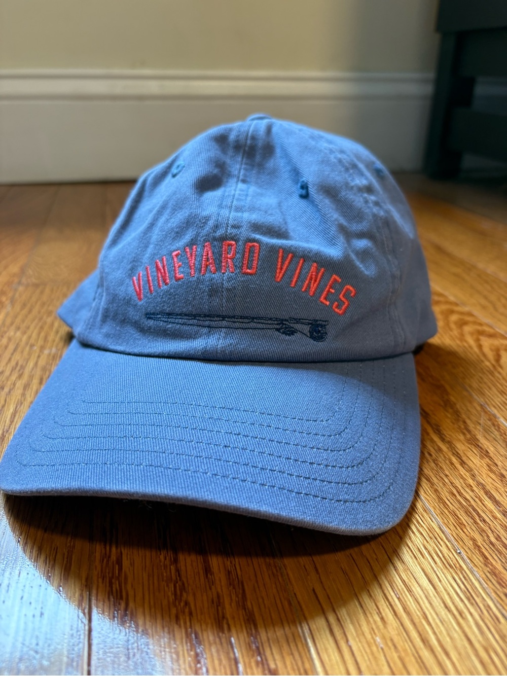 Vineyard Vines Slate Blue Baseball Cap with Red Logo and blue fishing rod